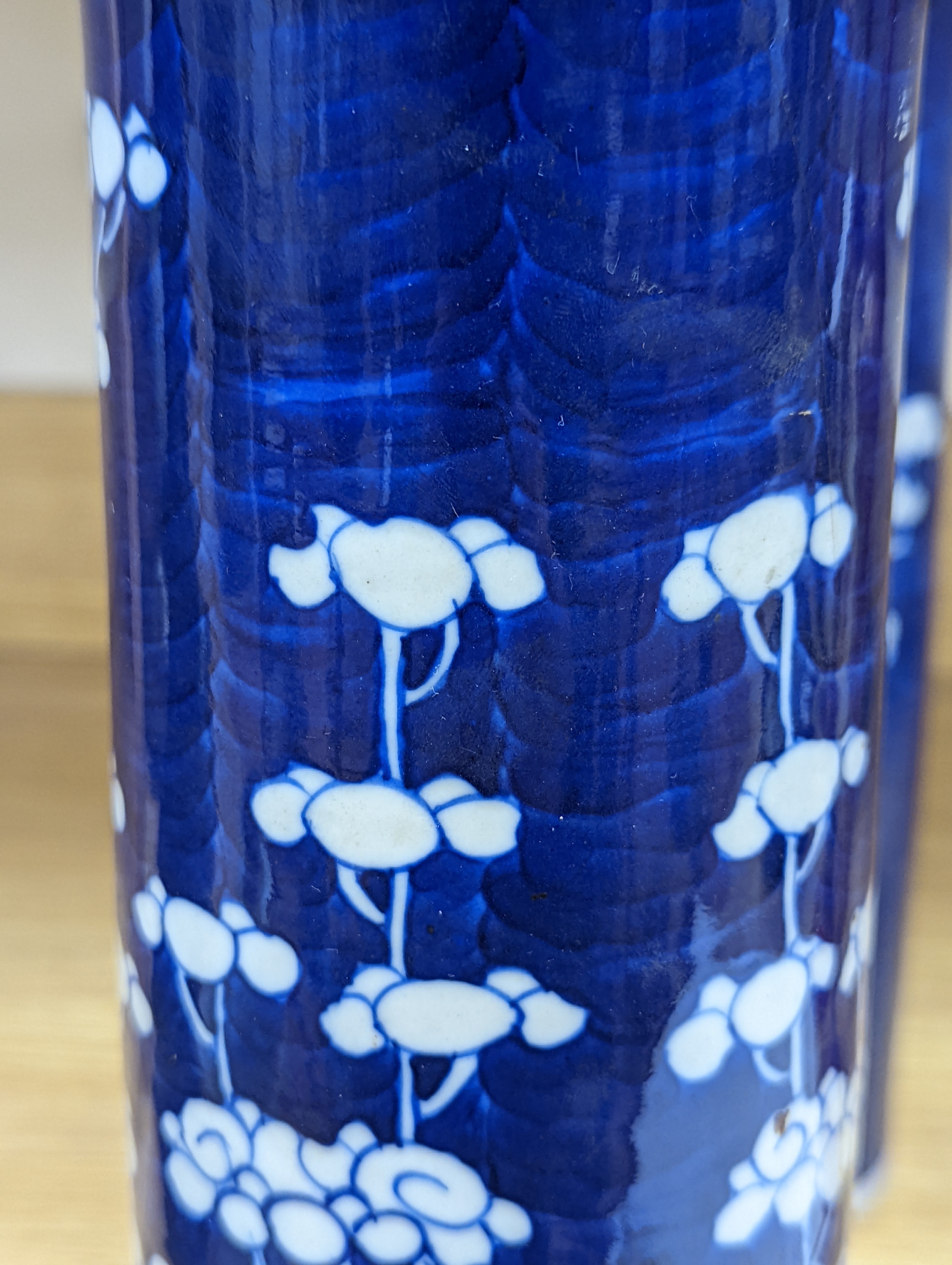 An 18th century Chinese famille rose mug, a Chinese Imari tea caddy and two Chinese blue and white sleeve vases 30cm (4)